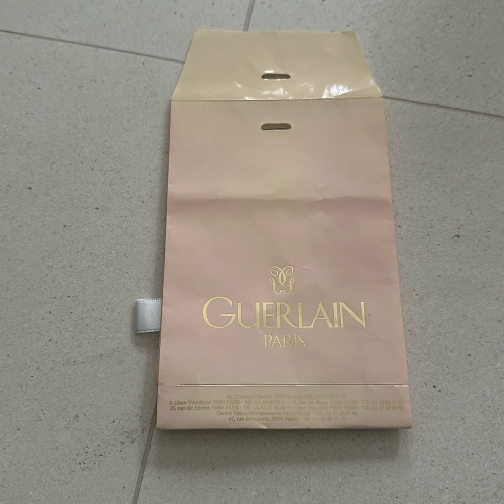 Very cute Guerlain Paris bag with ribbon closure.